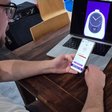 Participant testing a mobile app that controls a smart clock during a usability test