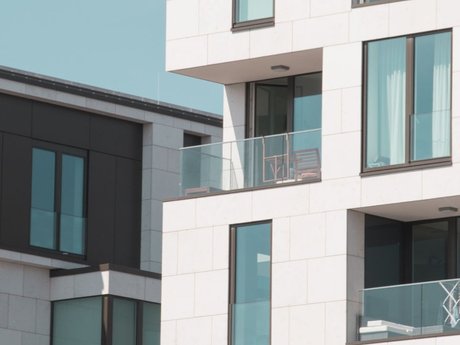 Modern apartment building with glass balconies